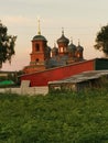 Summer landscape with stone church at sunset and meadow Royalty Free Stock Photo