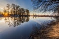 Rural summer sunrise landscape with river and dramatic colorful sky Royalty Free Stock Photo