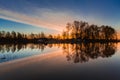 Rural summer sunrise landscape with river and dramatic colorful sky Royalty Free Stock Photo