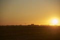 Rural sunset scene, bright orange sky over an Argentinian countryside Royalty Free Stock Photo