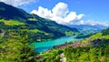 Rural Swiss Scenery from Train Ride Window View, Picturesque Picture as a Painting of Lungern Village and Lake