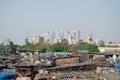 Rural to urban development of mumbai ,Maharashtra in one picture with trees and skyscrapers in background