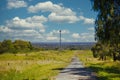 Rural trail on a lush valley with a view of Melbourne, Australia Royalty Free Stock Photo