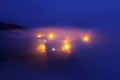 Rural village in Aramaio under fog at night