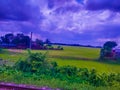 The rural village and cropland beside the railroad.