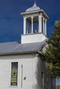 Rural Virginia church belltower with stain glass window