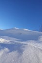 Rural winter landscape with a field snow and the blue sky Royalty Free Stock Photo