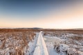 Rural winter landscape. Sunrise over snowy road Royalty Free Stock Photo