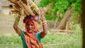 rural women doing hard work weight take on head