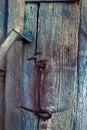 Rural wooden door with a metal hook