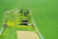 Rural wooden house on green field Royalty Free Stock Photo