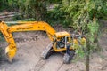 An unidentified driver standing on construction machinery on building site