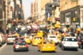 Rush hour with defocused cars and yellow taxi cabs Royalty Free Stock Photo