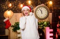 Rush hour. winter holidays. Its time for christmas. girl in red santa claus hat. Midnight. happy new year. christmas Royalty Free Stock Photo