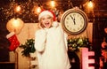 Rush hour. winter holidays. Its time for christmas. girl in red santa claus hat. Midnight. happy new year. christmas Royalty Free Stock Photo