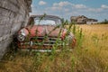 Rush Lake, SK- August 19, 2021: An abandoned Borgward Isabella TS and abandoned farmhouse on the Saskatchewan prairi