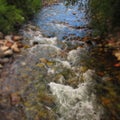 Rushing creak against stones