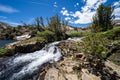 Rushing creek and small waterfall along the 20 Lakes Basin loop trail in California Royalty Free Stock Photo