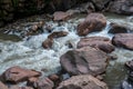 Rushing river flowing through eroded rocks in Tingo Maria Peru Royalty Free Stock Photo