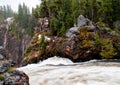 Rushing river past colors rocks