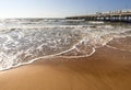 Rushing wave on a sunny day on the sandy beach of the Baltic Sea in Palanga, Lithuania Royalty Free Stock Photo