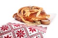 Rushnyk with korovai on white background. Ukrainian bread and salt welcoming tradition