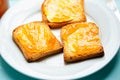 Rusk with apricot jam on blue surface Royalty Free Stock Photo