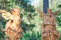 Ruskeala, Karelia - 2022.07.21: Wooden sculptures of Oberon and Titania at the Achinkoski waterfall