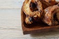 Rusks with chocolate chips on the heart shaped plate on the white wooden table Royalty Free Stock Photo