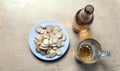 Rusks in a plate, a beer mug, and a bottle with cider on the table top view Royalty Free Stock Photo
