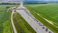 Aerial view on traffic jam on the road to toll station on highway A1 called Amber One