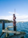 A Maori carving of a warrior on the Russell Wharf. Royalty Free Stock Photo