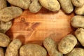 Russet Potatoes on a Wooden Background Royalty Free Stock Photo