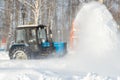 02/16/2022 Russia Agidel, Bashkortostan: A tractor of the municipal service removes snowdrifts in the park using a nozzle nozzle