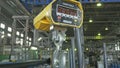 RUSSIA, ANGARSK - JUNE 8, 2018: Industrial type 5000 kg digital weight scale hanging on hook of crane, with clipping