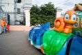 Russia, Arkhangelsk - July 2019. Two three-year-old white boys ride in a children`s open-carousel train. One baby is crying. Fun,