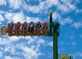 Russia, Arkhangelsk - July 2019. A young heterosexual couple rides scary merry-go-rounds in an amusement park. Emotions, extreme,