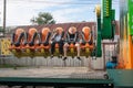 Russia, Arkhangelsk - July 2019. A young heterosexual couple rides scary merry-go-rounds in an amusement park. Emotions, extreme,