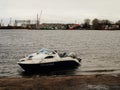 Russia - Arkhangelsk - Northern Dvina river - single boat at autumn day near river sandy coast