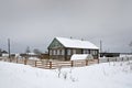 Russia, Arkhangelsk region, Kargopol district, village Niz in winter in cloudy weather Royalty Free Stock Photo