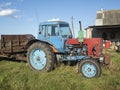 26.07.2020 Russia, Bryansk region. Old Tractor blue parking I.in iackyard In Summer Sunny Day. Special Agricultural Equipment