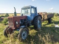 26.07.2020 Russia, Bryansk region. Old Tractor blue parking I.in iackyard In Summer Sunny Day. Special Agricultural Equipment