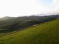 Russia, Caucasia, Ingushetia. Green mountain on blue sky background, horizontal view.