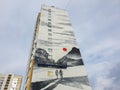 Russia, Chelyabinsk 08/03/2020 Create a modern look by painting on the wall of a building. Industrial climbers paint a picture on