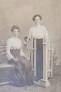 RUSSIA - CIRCA 1905-1910: Full body shot of two young women in studio, Vintage Carte de Viste Edwardian era photo Royalty Free Stock Photo