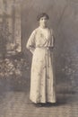 RUSSIA - CIRCA 1905-1910: Full body shot of young woman in studio, Vintage Carte de Viste Edwardian era photo Royalty Free Stock Photo