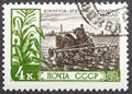 RUSSIA - CIRCA 1961: Postage stamp printed in Soviet Union Russia shows man planting corn, For an Abundance of Farm