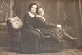 RUSSIA - CIRCA 1920s: Shot of two young women in studio, Vintage Carte de Viste Edwardian era photo Royalty Free Stock Photo