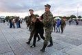 Russia, city of Magnitogorsk, - August, 7, 2015. Russian police escort the alleged offender to the exit from the town square. Law