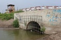 Russia, the collector pipe sucks water from the lake into the sewer dangerous grate from garbage